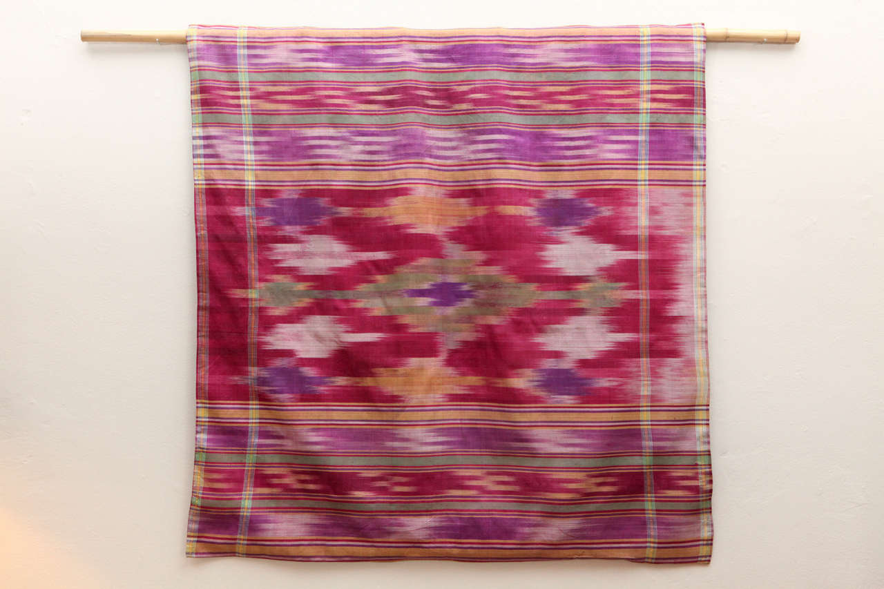 Vintage silk ikat with cotton backing.  Purple, green, raspberry, yellow and ivory.