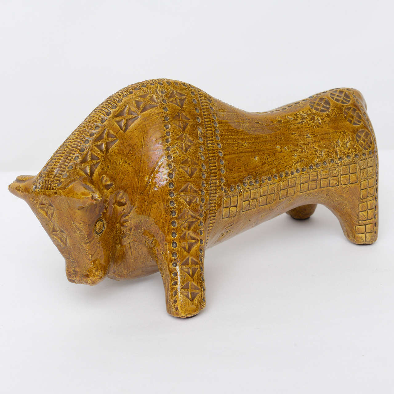 Ceramic bull by Bitossi in a unique rich, mustard-brown glaze.