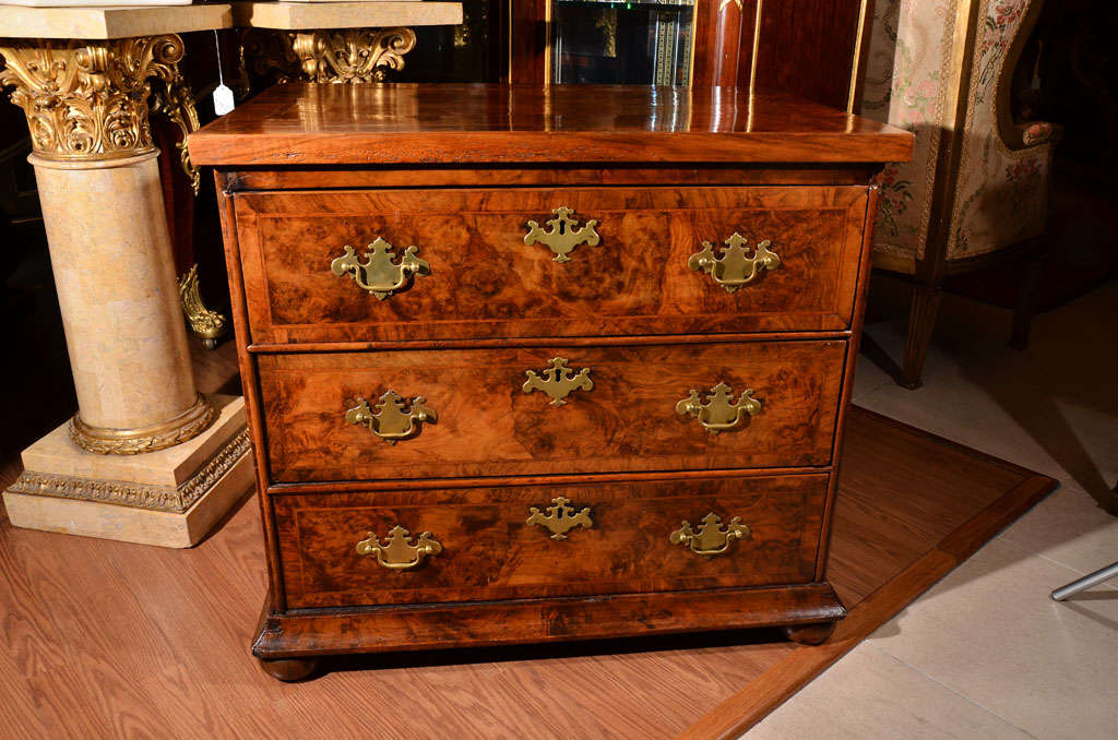 18th c beautiful burled Walnut Queen Anne chest of drawers on but feet. Original hardware. Secondary wood oak