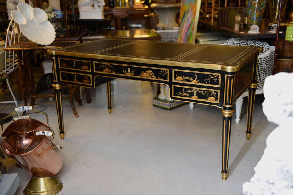 Elegant black lacquer Chinoiserie Bureau Plat with Dore Bronze fittings.  Black leather top, five locking draws and finished on both sides.