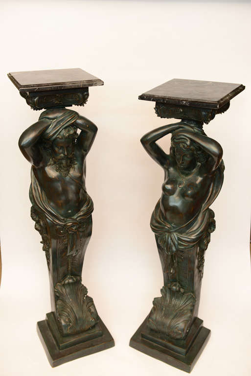 Male & Female Cast Bronze each fitted with a square marble top
measuring 12