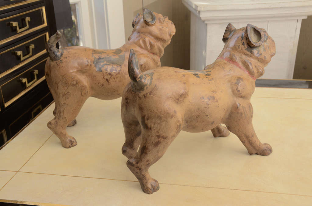 Attractive pair of polychrome decorated terracotta figures of standing bull dogs