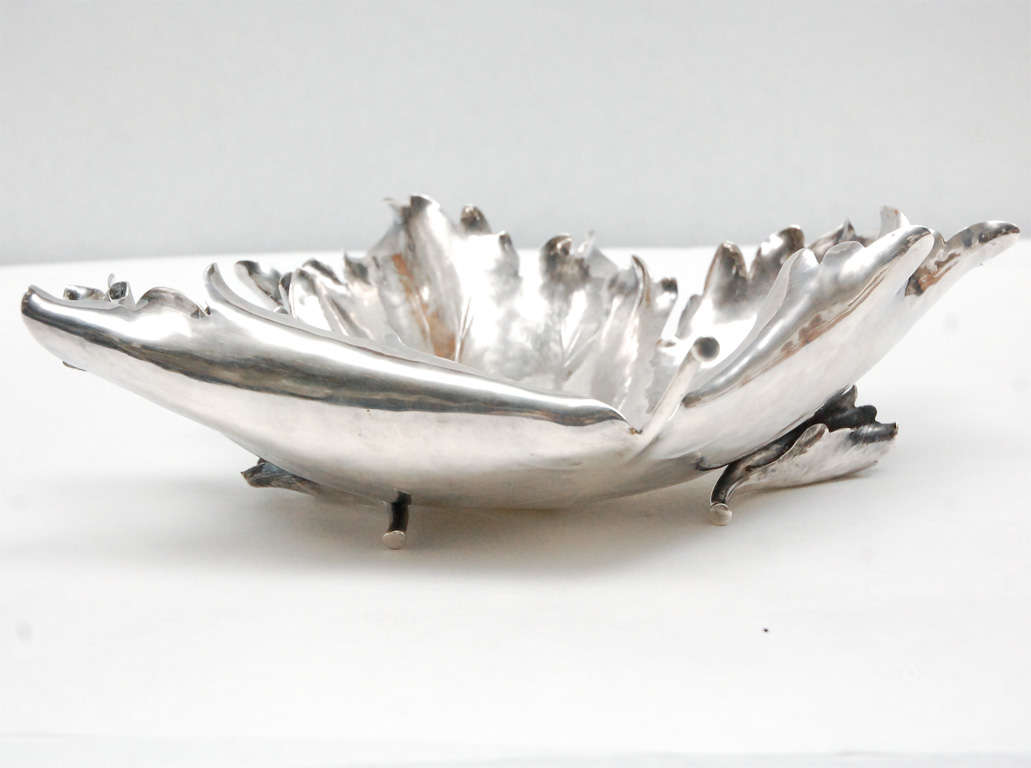 A beautiful sterling silver Italian maple leaf dish by Buccellati. Very detailed, with ruffled leaf edges and veining etched into the dish. The dish rests on two smaller rolled leaves as feet. Stamped on the underside 