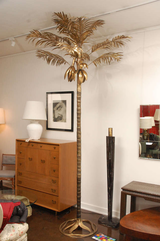 Monumentally tall Arthur Court palm tree, made of solid brass.  Standing approximately 10 feet tall, the stem unscrews in three different sections and the palm fronds can be inserted individually into the top of the tree.  The two coconut plants