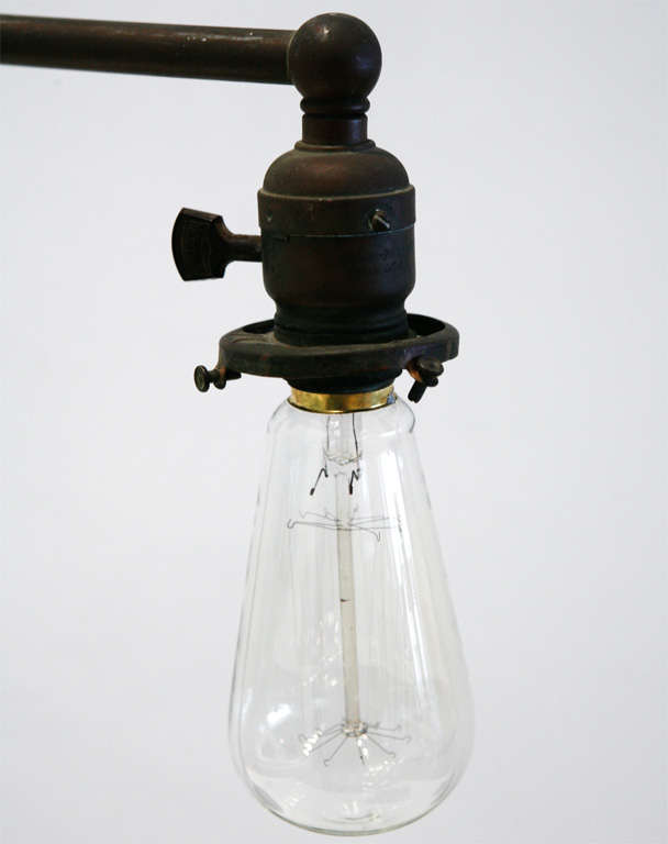 a beautifully patinated & super heavy bronze double-headed task light from new england. 