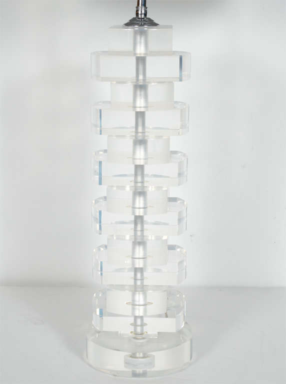 Mid-Century Modern column lamp comprised of stacked and beveled Lucite blocks. Polished chrome stem and fittings, and fitted with two lights and two pull chains. Shown with grey linen drum.