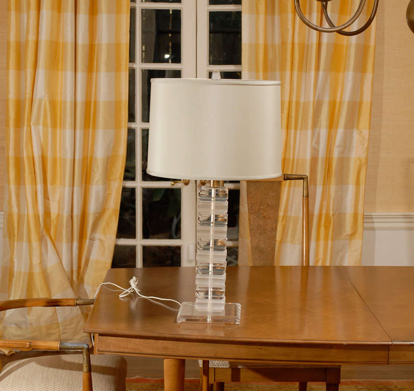 Great pair of stacked lucite lamps. While the lamps are unmarked, they are reminiscent of the Karl Springer lamp production of the 1970's. Constructed of alternating chuncks of clear and frosted lucite . Excellent Vintage Condition. The price noted