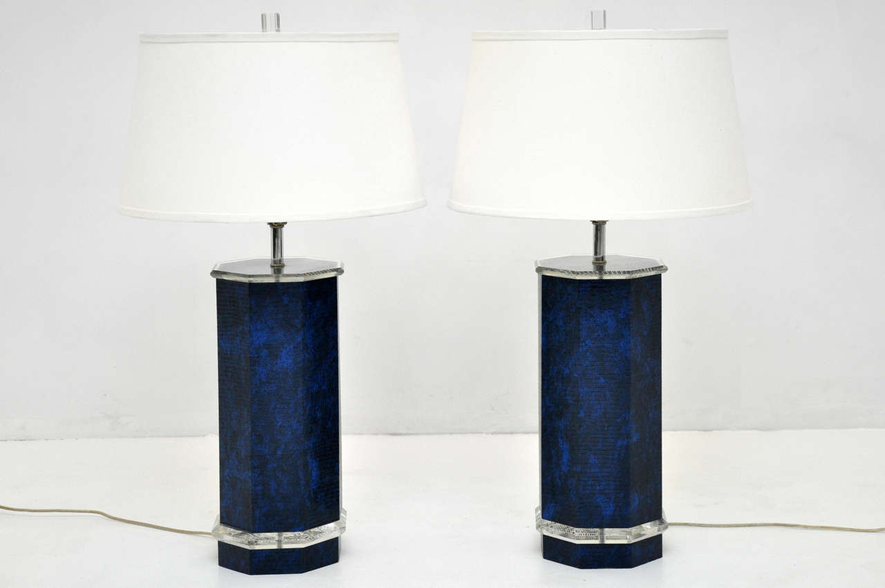 1970's lucite lamps wrapped in vivid blue faux snakeskin.  In the style of Karl Springer.

*Shades not included.