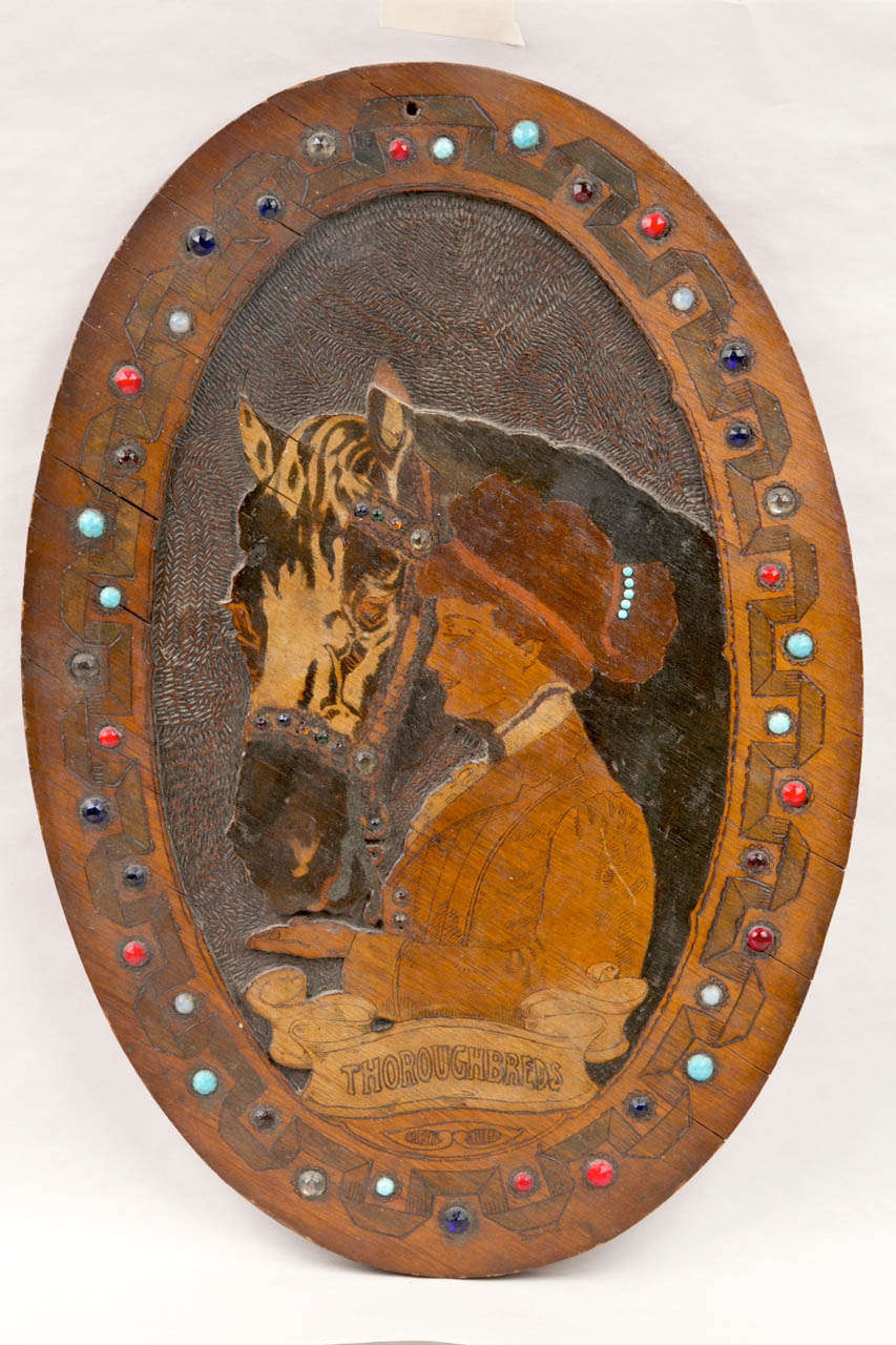 pyrography wall art featuring equestrian motif with a notable array of beads around the border. unusual example of folk art