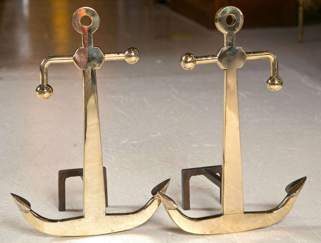 These brass vintage art moderne anchor andirons are of incredible quality--solid, heavy and unique. Notice there is a left and right one (not duplicates of each other, but mirror images). Newly polished un-lacquered brass. 