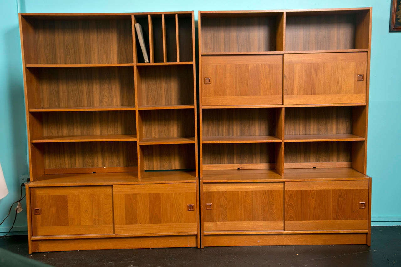 Mid Century Danish Modern Teak Wall Units by Domino Mobler  Units are uniquely different, but complimentary
Teak Shelves and Sliding Doors

They can be sold together or separately 
$2000 pair
$1000 Individual