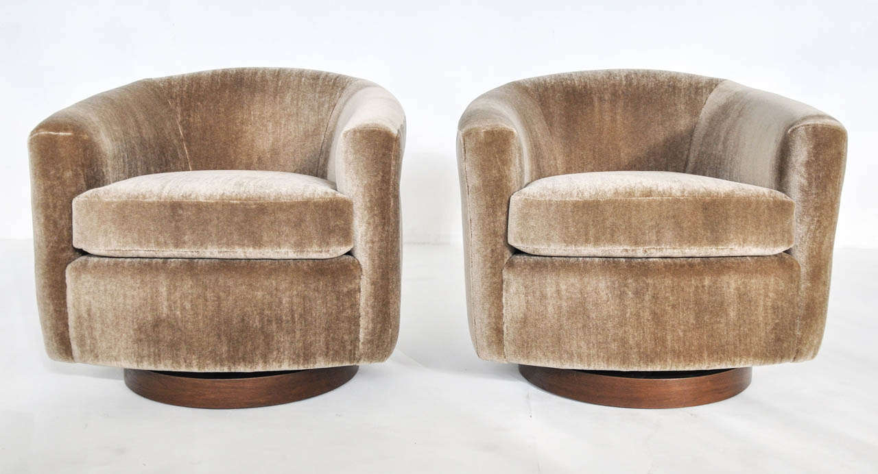 Milo Baughman swivel lounge chairs.  Fully restored.  Newly upholstered in ultra plush mohair.  Refinished walnut bases.  Chairs rock/tilt and swivel.