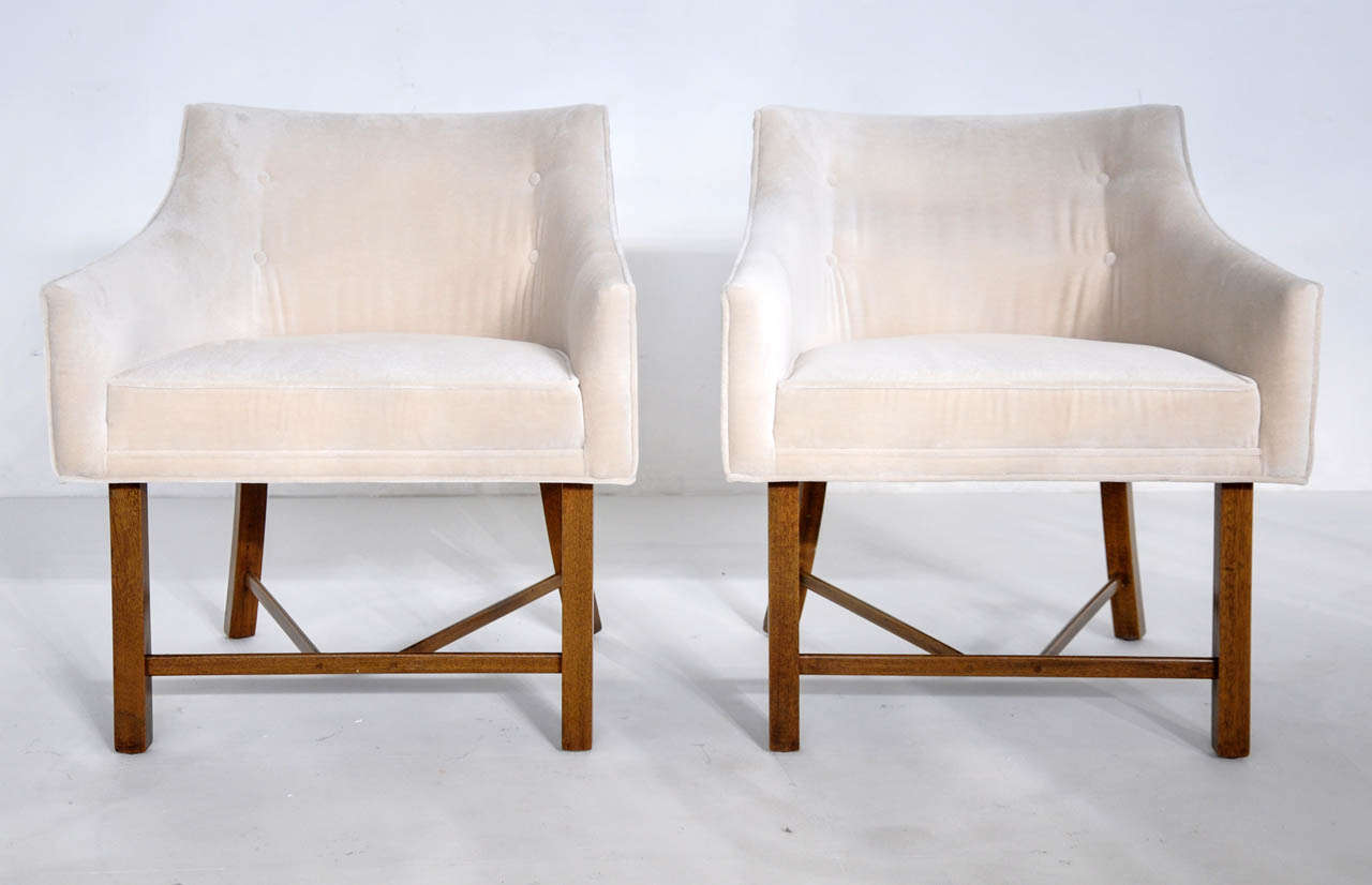 Pair of arm chairs by Harvey Probber.  Ivory silk mohair over mahogany frames.