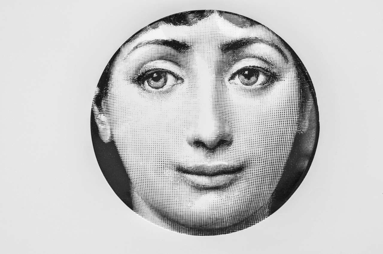 An early production plate by Fornasetti showing an enigmatic and serene image of his muse, Lina Cavalieri. Beautiful graphic design.