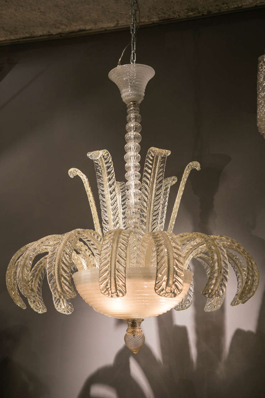 Impressive and elegant original vintage Murano chandelier from the 1950. All the glass elements and the mounting are vintage and complete. Very beautiful light inside the glass cup made of 