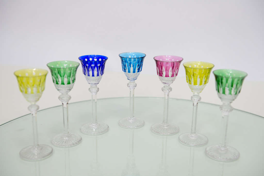 This is a Saint-Louis set of seven superb Liquor colored crystal glasses come from the famous pattern Tommy. The glasses are signed Cristal Saint Louis France, hardly noticeable. Crystal are not suitable for the dishwasher. Look at the diameter,