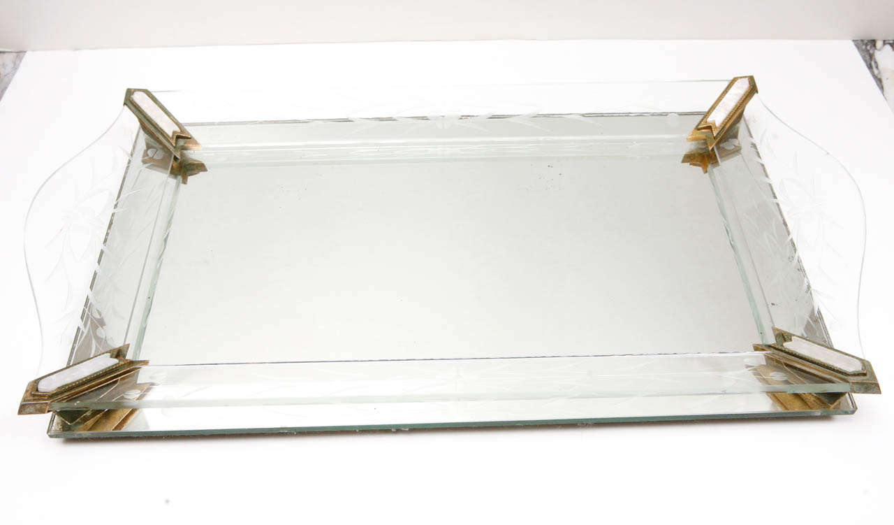 Mirrored tray with etched glass sides and bronze corner pieces that are capped with mother-of-pearl.