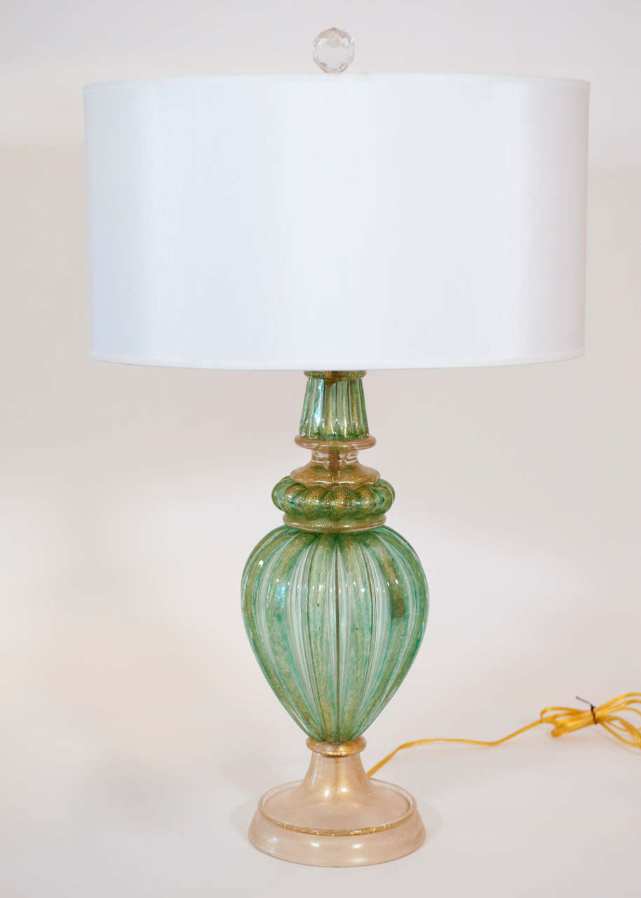 A sumptuous light green and gold accented Murano table lamp with regal
proportions.....Matches the other single 
green and gold Murano lamp...Measurement doesn't include shade height.