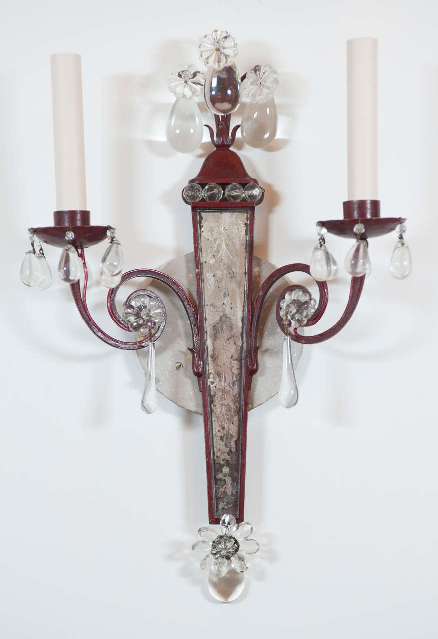 A highly decorative pair of red painted metal two light sconces with distressed
Venetian style etched and glass bead work.