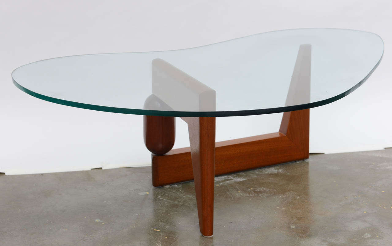 Classic and chic vintage 'Boomerang' cocktail table with glass top.
