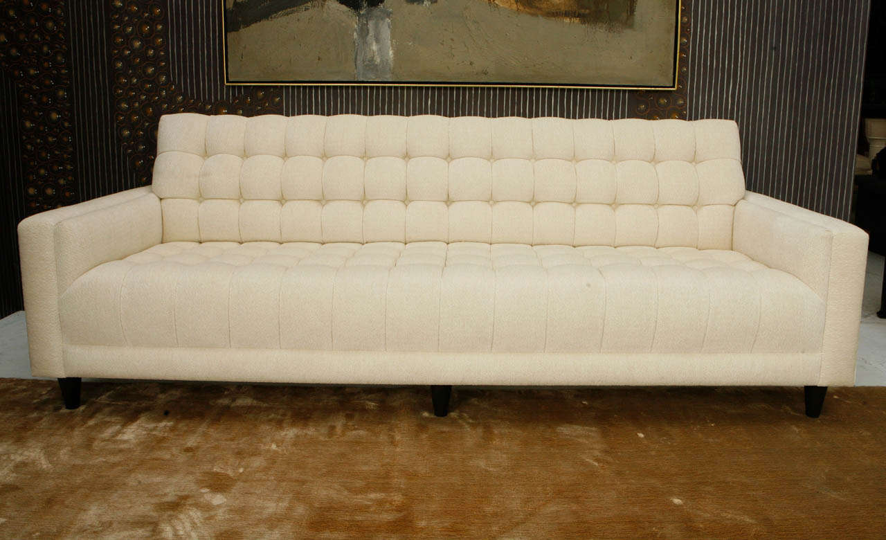 A magnificent custom biscuit-tufted sofa by William Haines. This sofa is from the estate of Twentieth Century Fox president, William Goetz and his wife Edie. Edie was the daughter of Louis B. Mayer, who famously led to William Haines leaving the