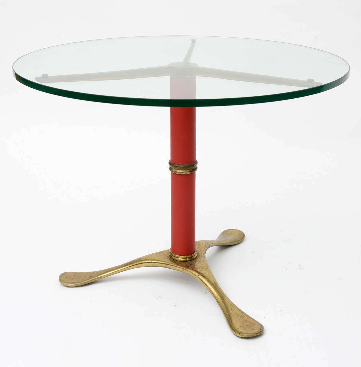 Brass table from Italy by Paolo Buffa. Brass has nice patina, centre column is wrapped in red leather.