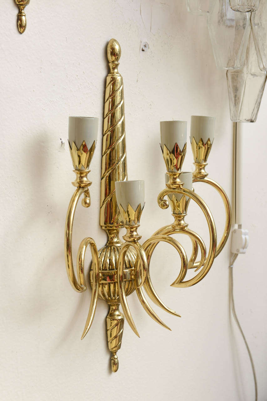 Pair of Art Deco brass sconces with five shades Stilnovo Style and made in Italy circa 1950.
In perfect working condition and each Sconce takes 5 candelabra E-14 light bulbs. 
Looks great next to a Neoclassical Wall Mirror or above a Fireplace