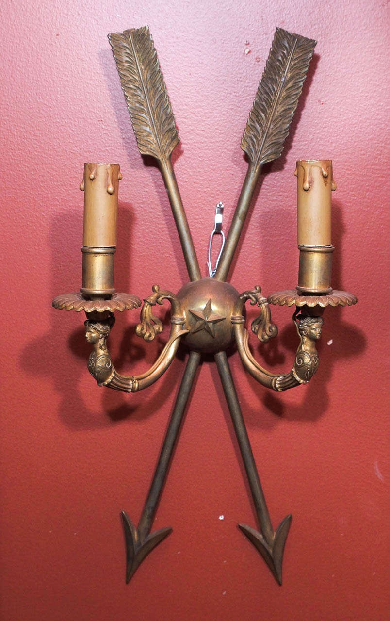 Pair 19th century 2 arm bronze sconces.  Directoire style with star and down pointed arrows.  U.S. wired.