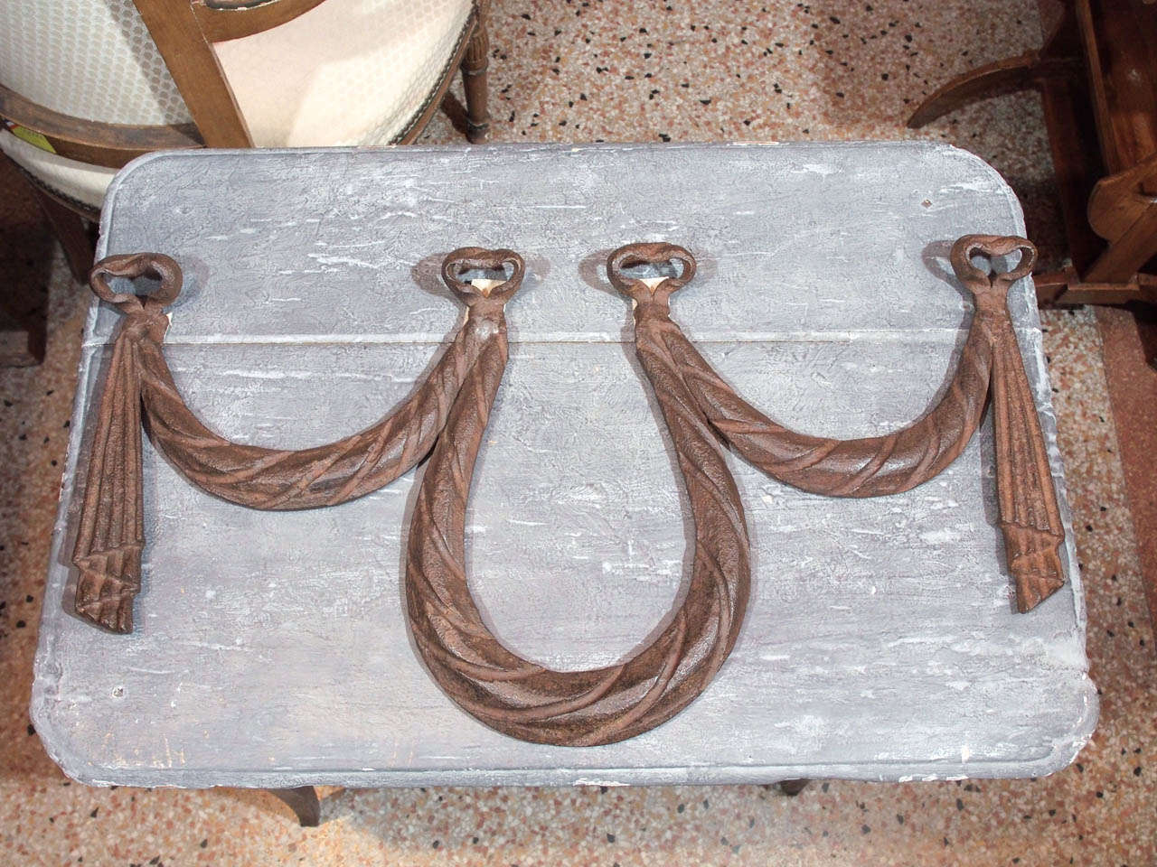 Decorative 19th century cast iron swag with a great patina
