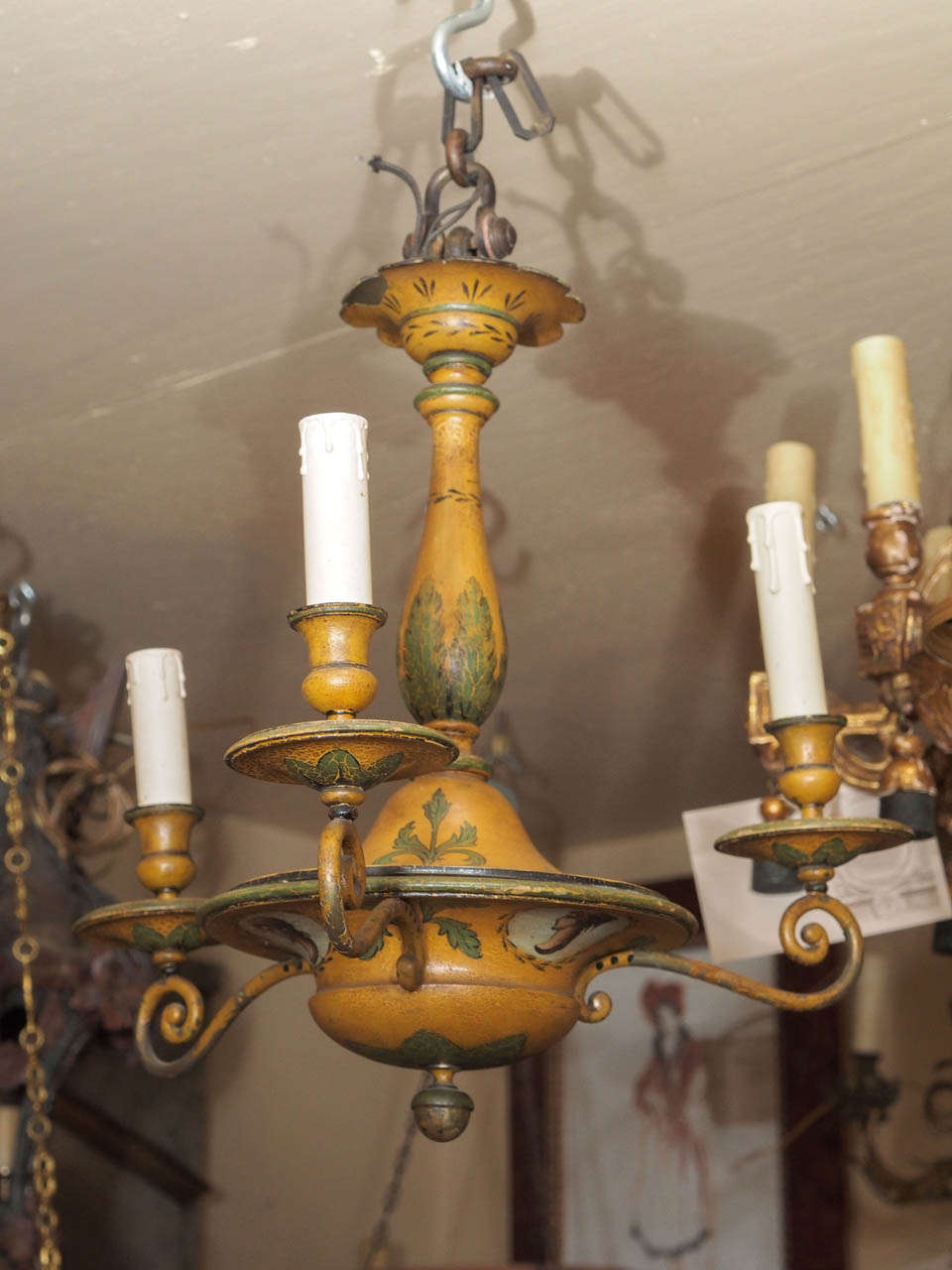 Charming 3 arm painted tole chandelier. Green and yellow with light colored cartouches of female profiles.