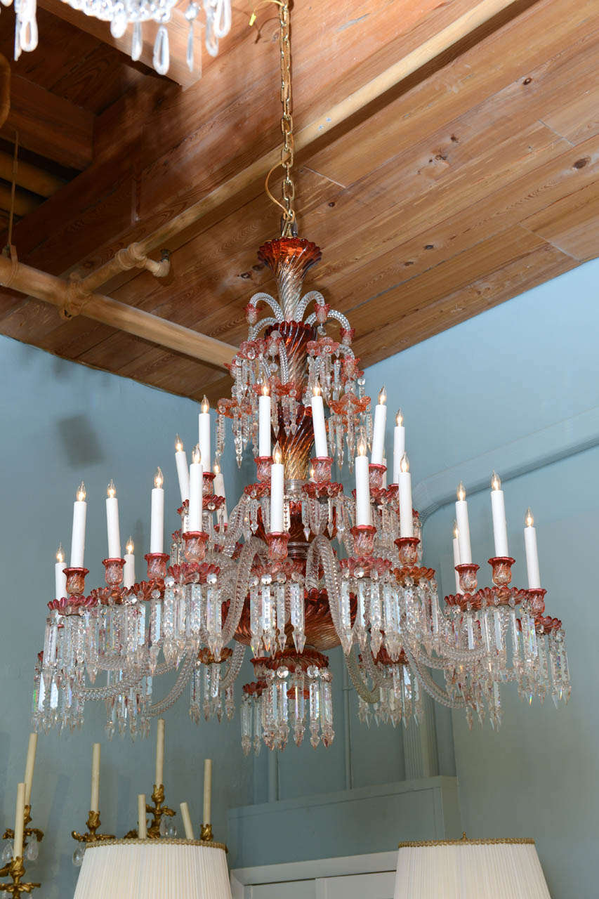 A massive palatial and rare red and clear Baccarat multi tiered chandelier.  Circa 1860