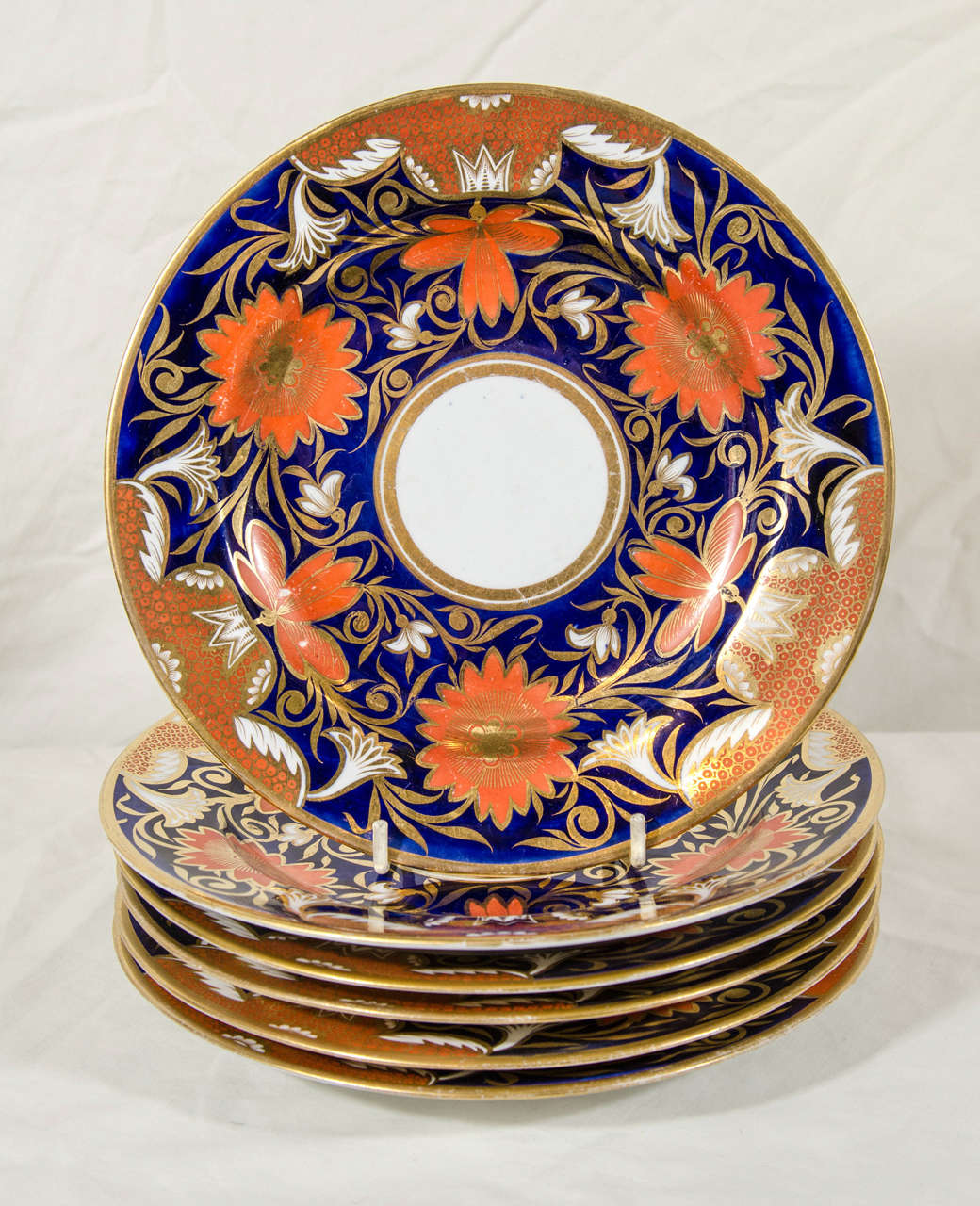 The Prince of Wales Feathers mark on this group of Spode dishes indicates that this pattern was part of the prince's collection. Made between 1806-1811 it is a stunning example of Regency porcelain decorated with orange blossoms, flowers and gilded