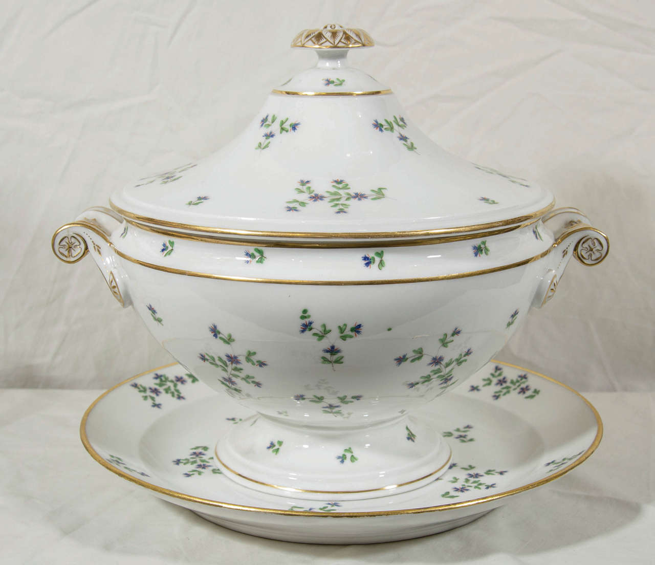 The tureen was manufactured by Nast, one of the exceptional French porcelain makers of the early 19th century. It is made of hard paste porcelain and decorated in the 