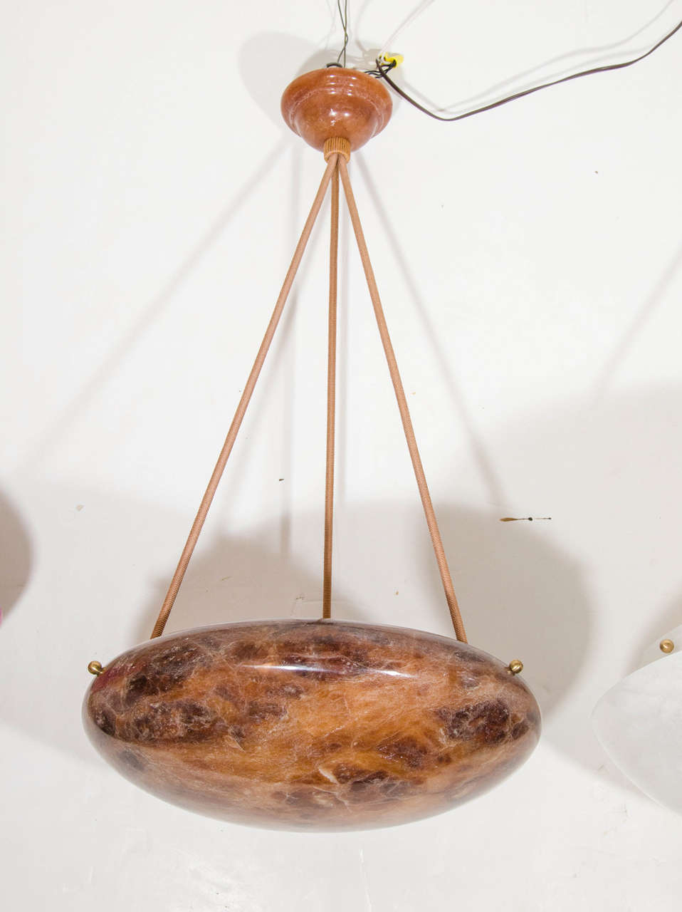 This elegant amber toned sphere is suspended by three electrified ropes and holds 3 x 60 watt incandescent bulbs or three unlimited wattage LED bulbs.