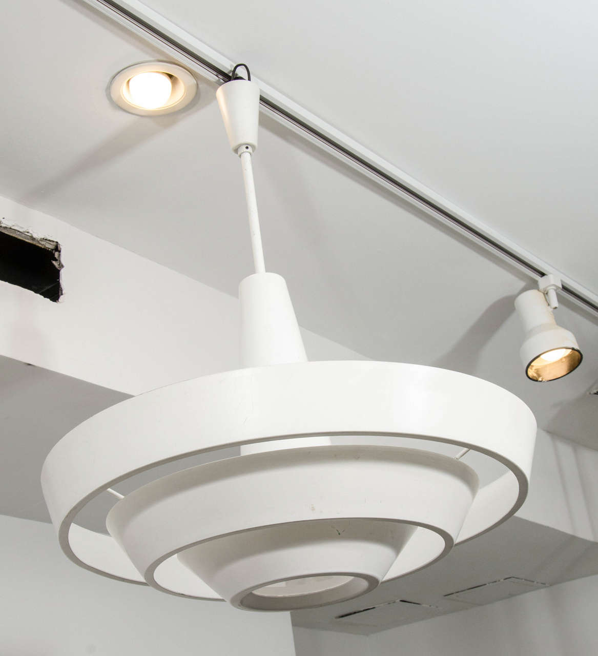 Enameled aluminium fixture made of three concentric circles with a glass diffuser in the middle.