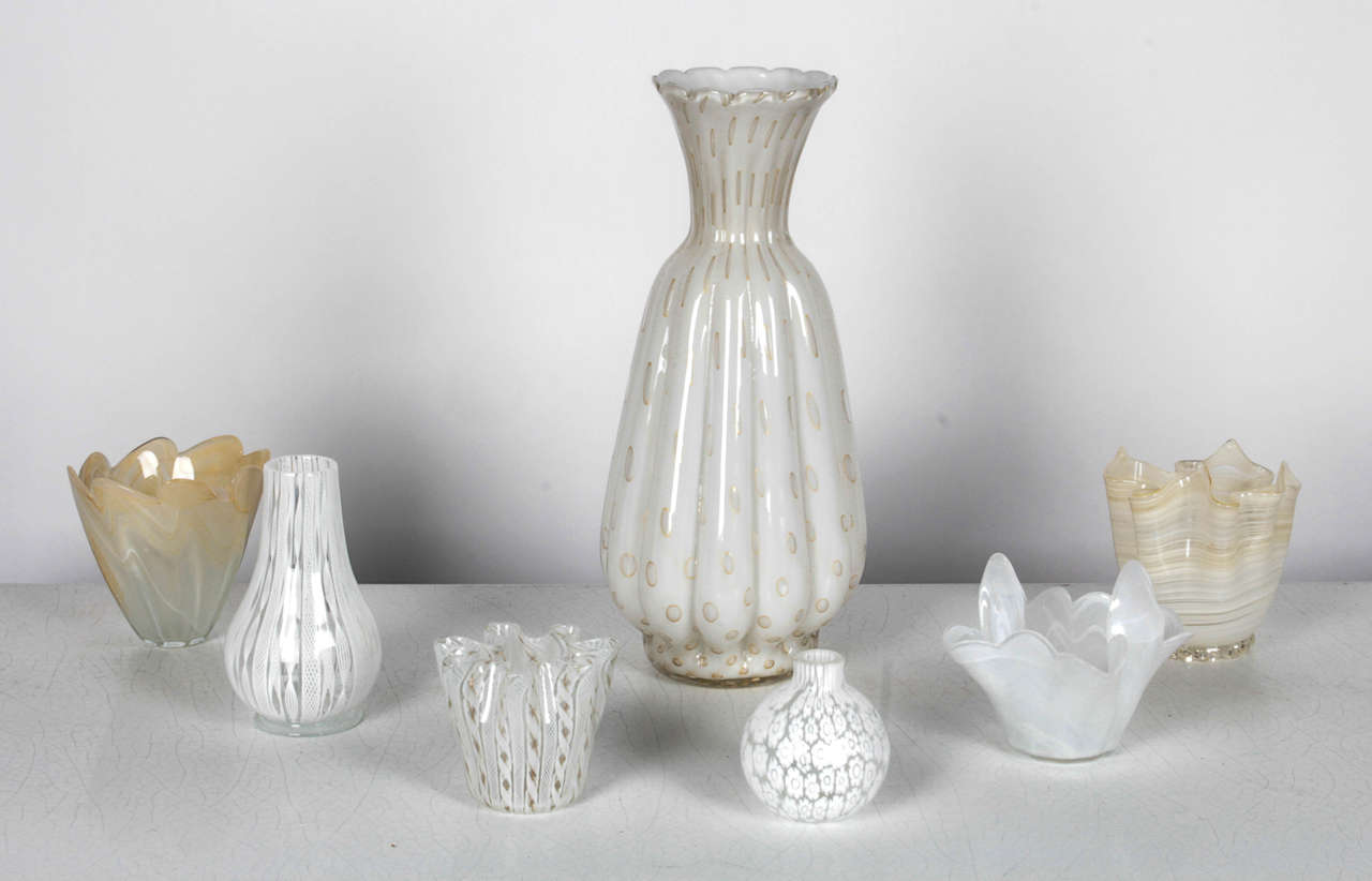 Murano glass vases of various shapes and sizes. Vases are all in the white and cream families. Colors can be seen more closely in the additional photos.

*Not available for sale or to ship in the state of California.