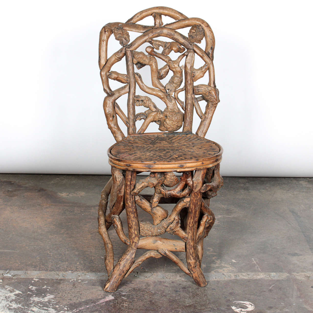 This airy chair constructed from driftwood adds a warmth of nature to any space. The seat surface is designed in a star pattern (see picture).

Not available for sale or to ship in the state of CA.