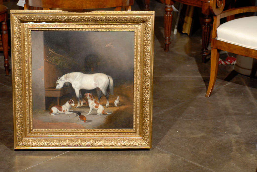 White horse and dogs in stable oil on canvas in gilt frame.