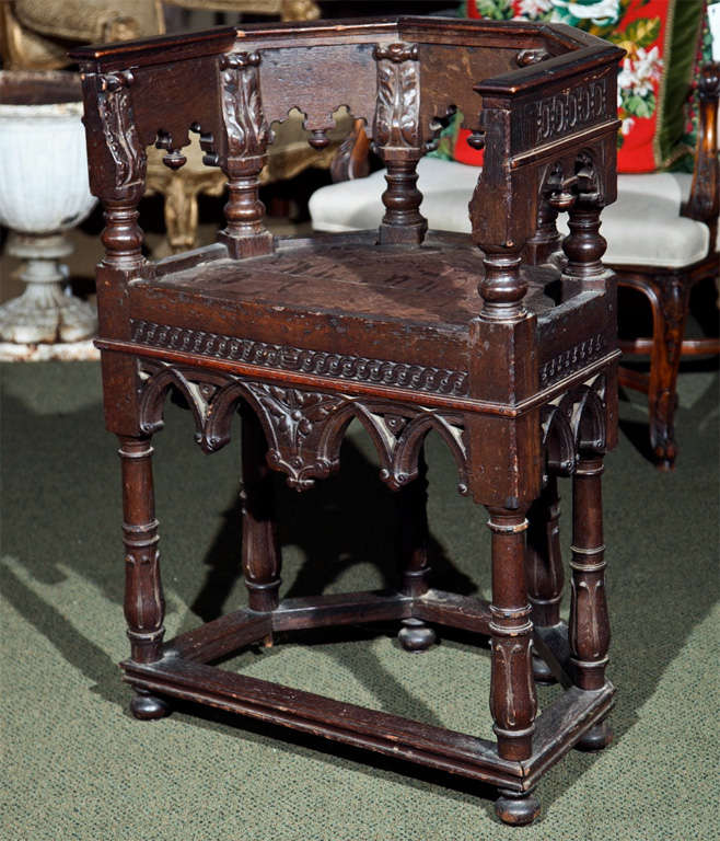 A continental gothic baroque deacon style chair.