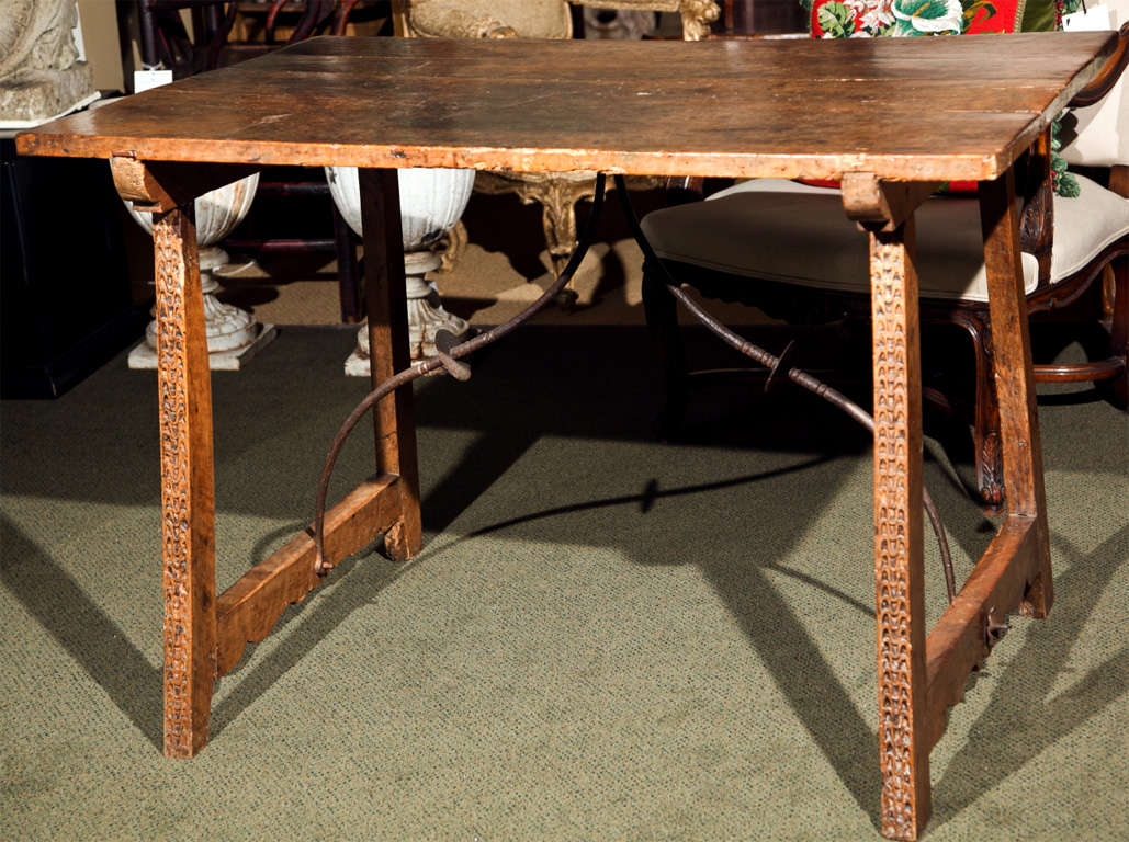 17th Century Spanish walnut tressle table. Hand forged iron stretcher. Provenance: Tobler Chocolate Estate at George Subkoff.