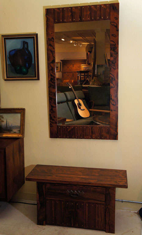 Unique mirror and console table in jacaranda wood with copper gromet design.<br />
Mirror measures 54