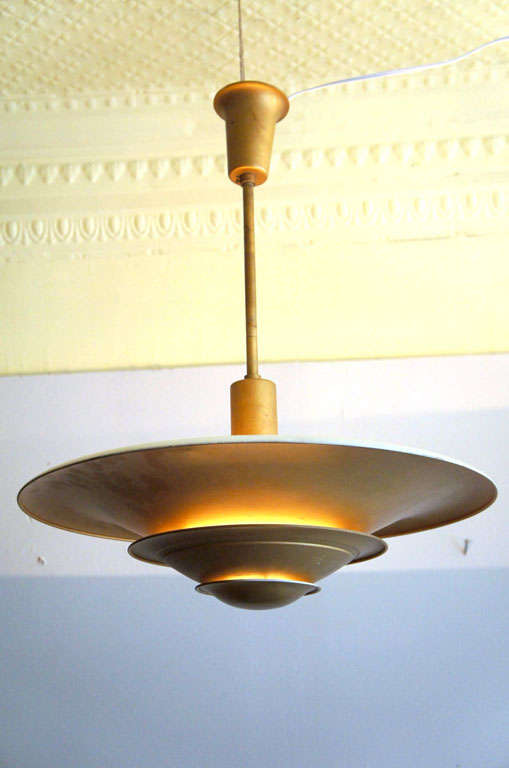 Pair of hanging lamps in gold metal by Louis Poulsen, Danish Mid-Century Modern.