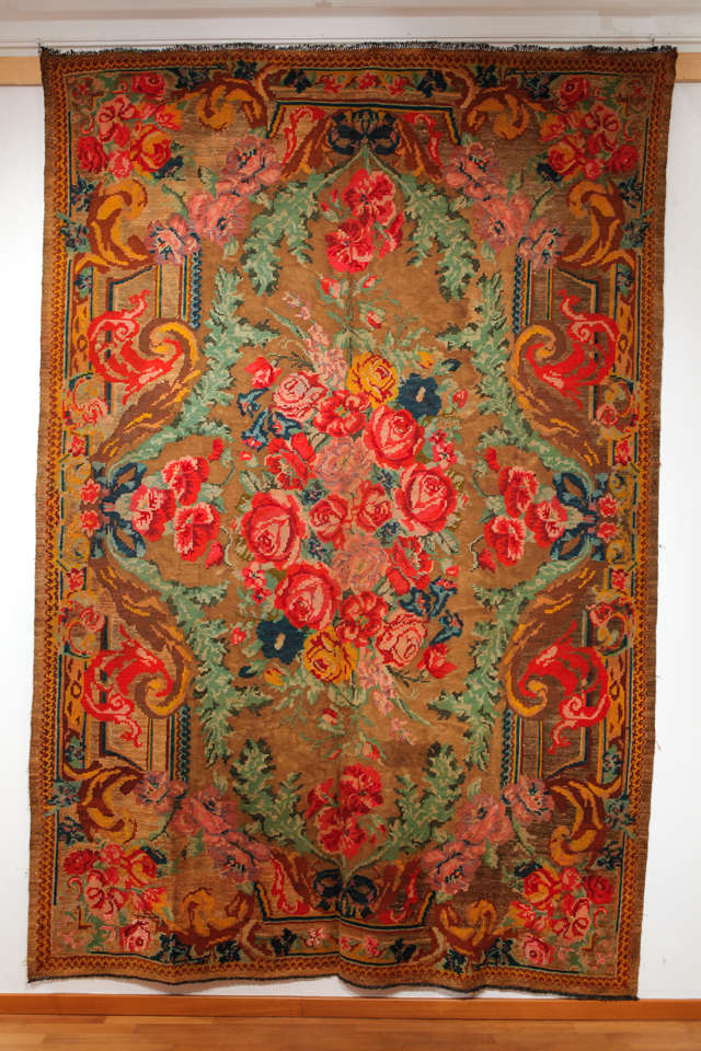 This Bessarabian is distinguished by the background being woven entirely in cotton while the floral motifs are in wool. Flatweaves of this type are true village renditions of more formal floral carpets such as French Aubussons, which were highly