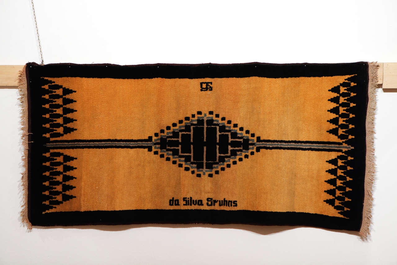 The rare examples attributed to Ivan da Silva Bruhns (1881-1980) are among the most sought after French Art Deco weavings. His first rugs, such as the example shown here, are influenced by the iconography of Moroccan Berber weavings, which at the