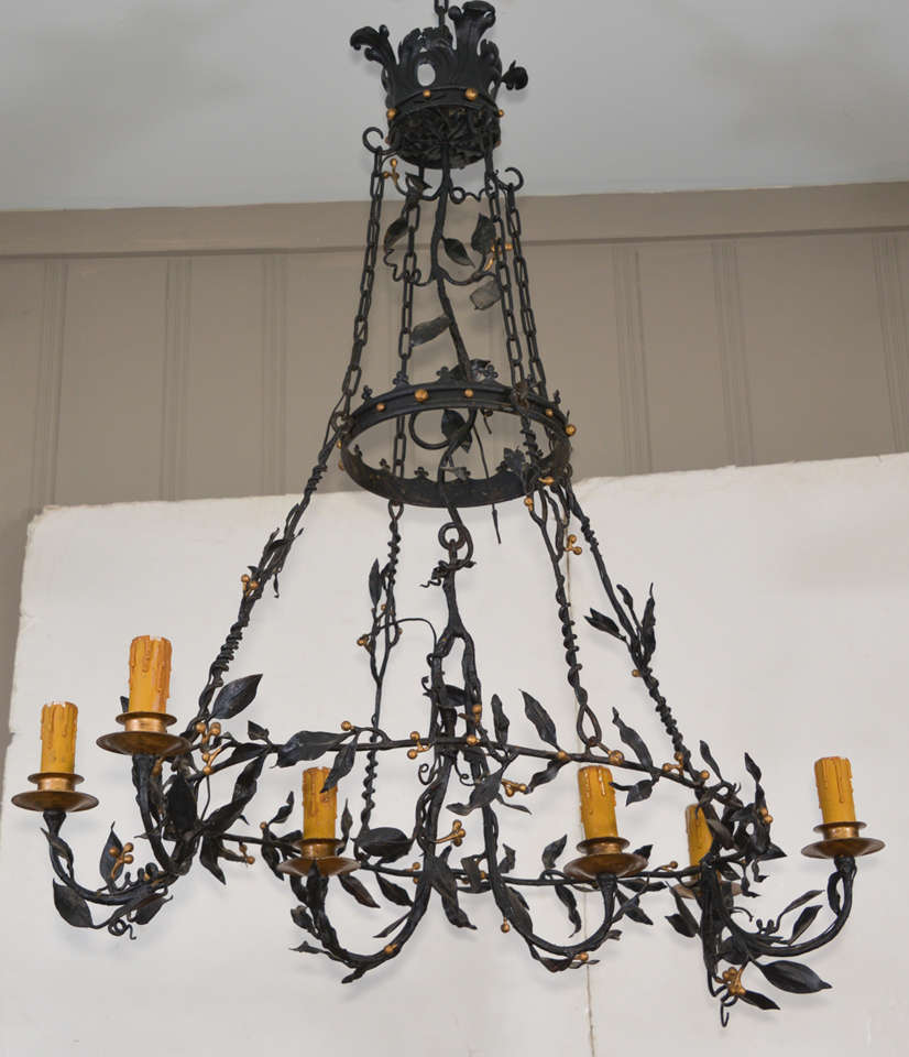 Beautiful hand forged chandelier with leaves, vines, berries and crowns, six lights. Very special from someone very talented. 