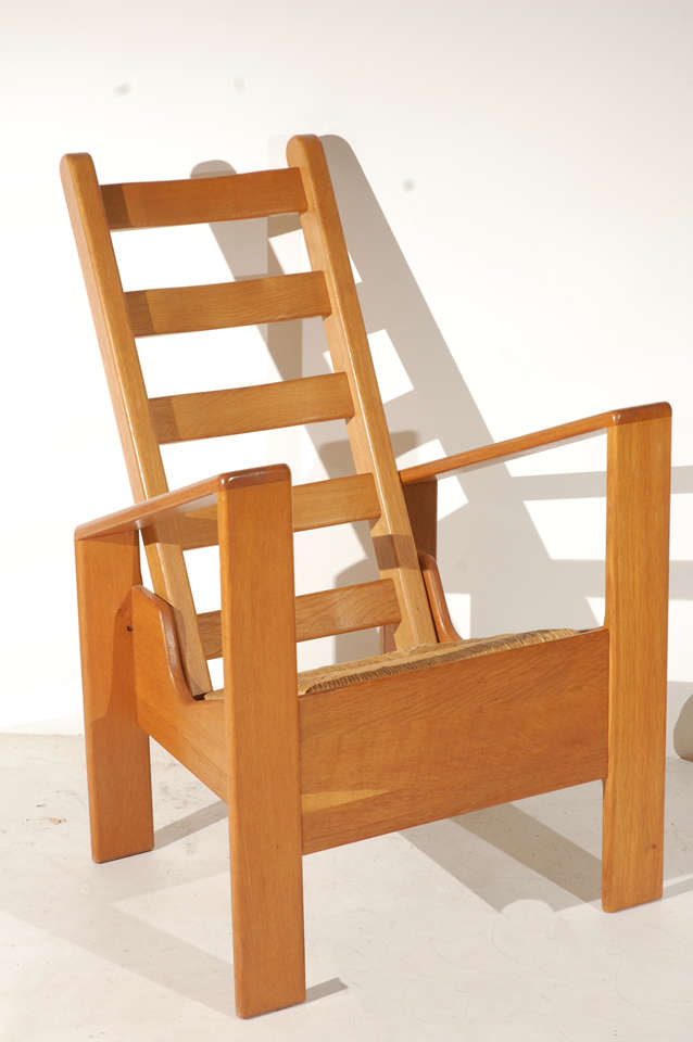 Sharp angles, ladder back, and rushed seat provide a dramatic and sculptural touch to any room. This is a very comfortable conversational piece.