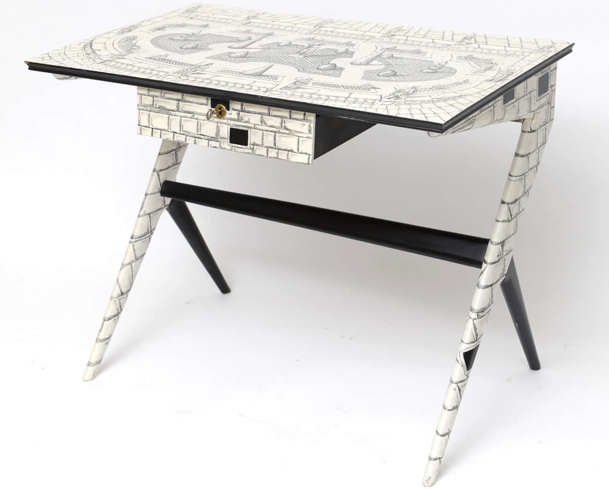 Vintage pen-worked writing desk is a painstaking homage to an earlier work by Piero Fornasetti. We so appreciate the craft that went into it, but love it for the admiration this gifted amateur must have had for the Italian master.