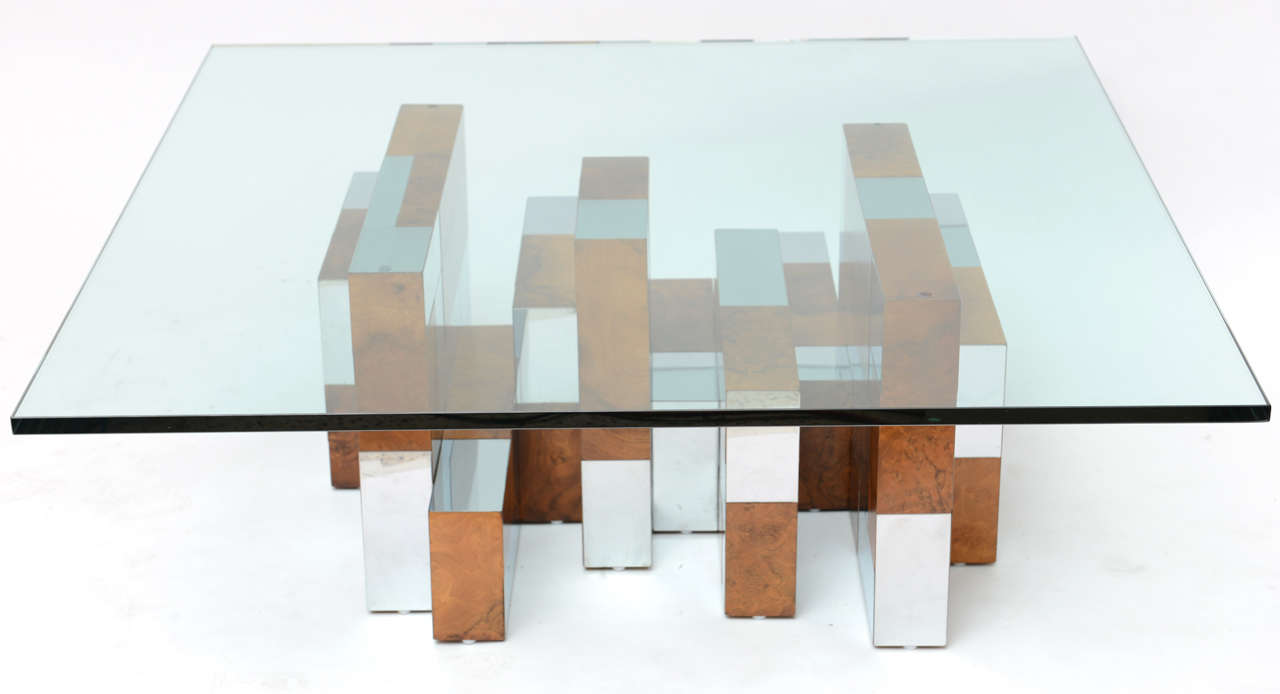 Rich burled walnut and chrome combine in this mid-century favorite by Paul Evans for Directional. Half-inch glass top.
Signed 