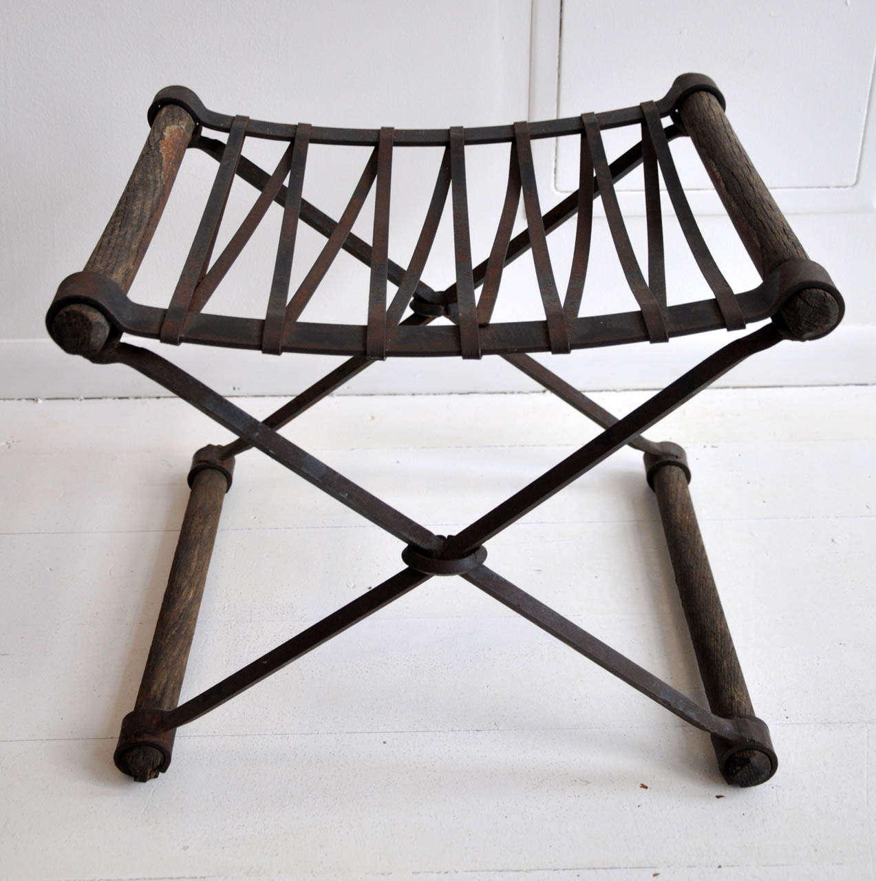 Iron and wooden 'X' base stool. Quite dramatic and it's perfect patina really packs a punch!