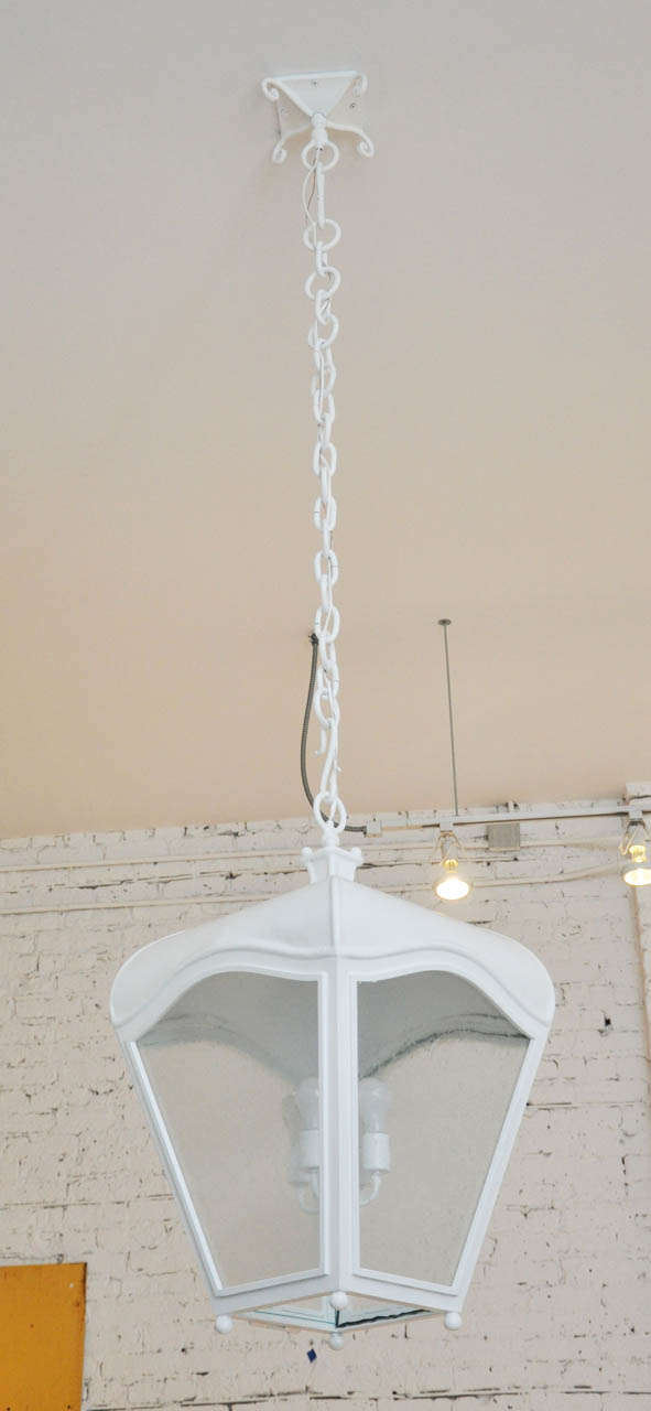 Four-lantern chandeliers newly painted in crisp white. Larger size also available.